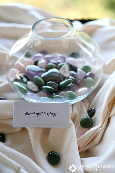 Vase filled with stones that guests have held in their hands and given blessings for the marriage.