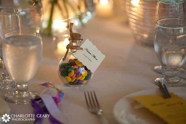 Bottle of personalized M&Ms used as a wedding place card and favor