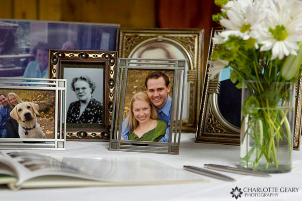Engagement portraits displayed among a collection of family photographs