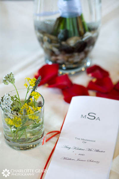 Wedding program tied with a red ribbon
