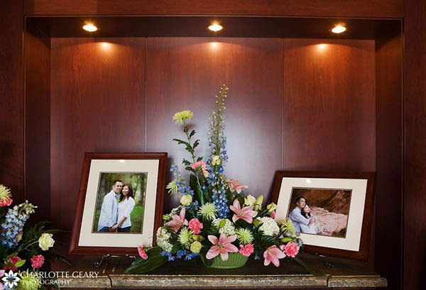 Display of engagement portraits at the wedding reception