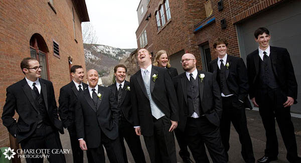 Groomsmen in black ties and vests