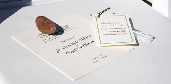 Wedding program held in place with a stone
