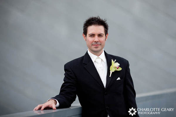 Groom with a green orchid boutonniere