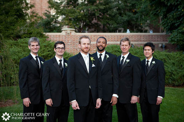Groomsmen in black suits and ties