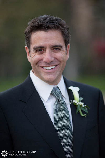 Groom in gray tie and calla lily boutonniere