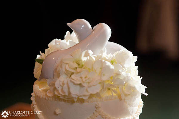 Cake topper at a lovebird themed wedding