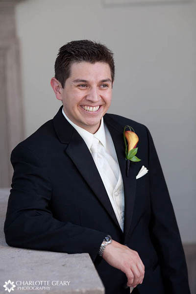 Groom with white tie and orange boutonniere