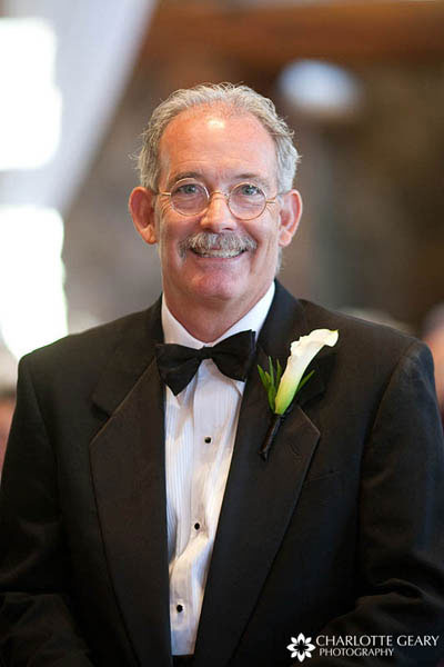 Father of the bride in tuxedo with calla lily boutonniere
