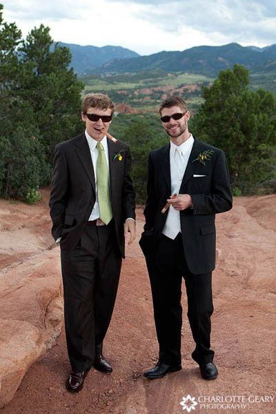 Groom and groomsman with cigars and sunglasses