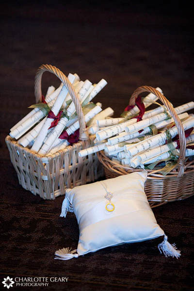 Wedding programs rolled and tied with ribbons