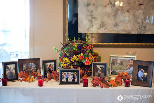 Display of engagement portraits at wedding reception
