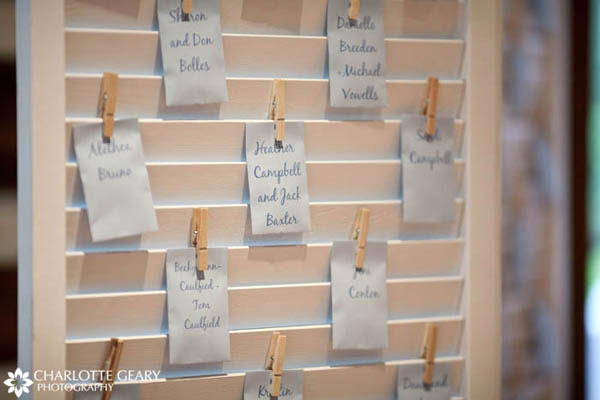 Place cards in blue envelopes hung with clothespins