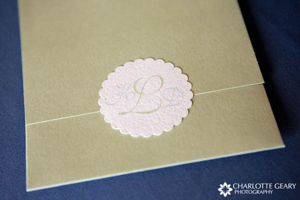Green monogrammed wedding invitation